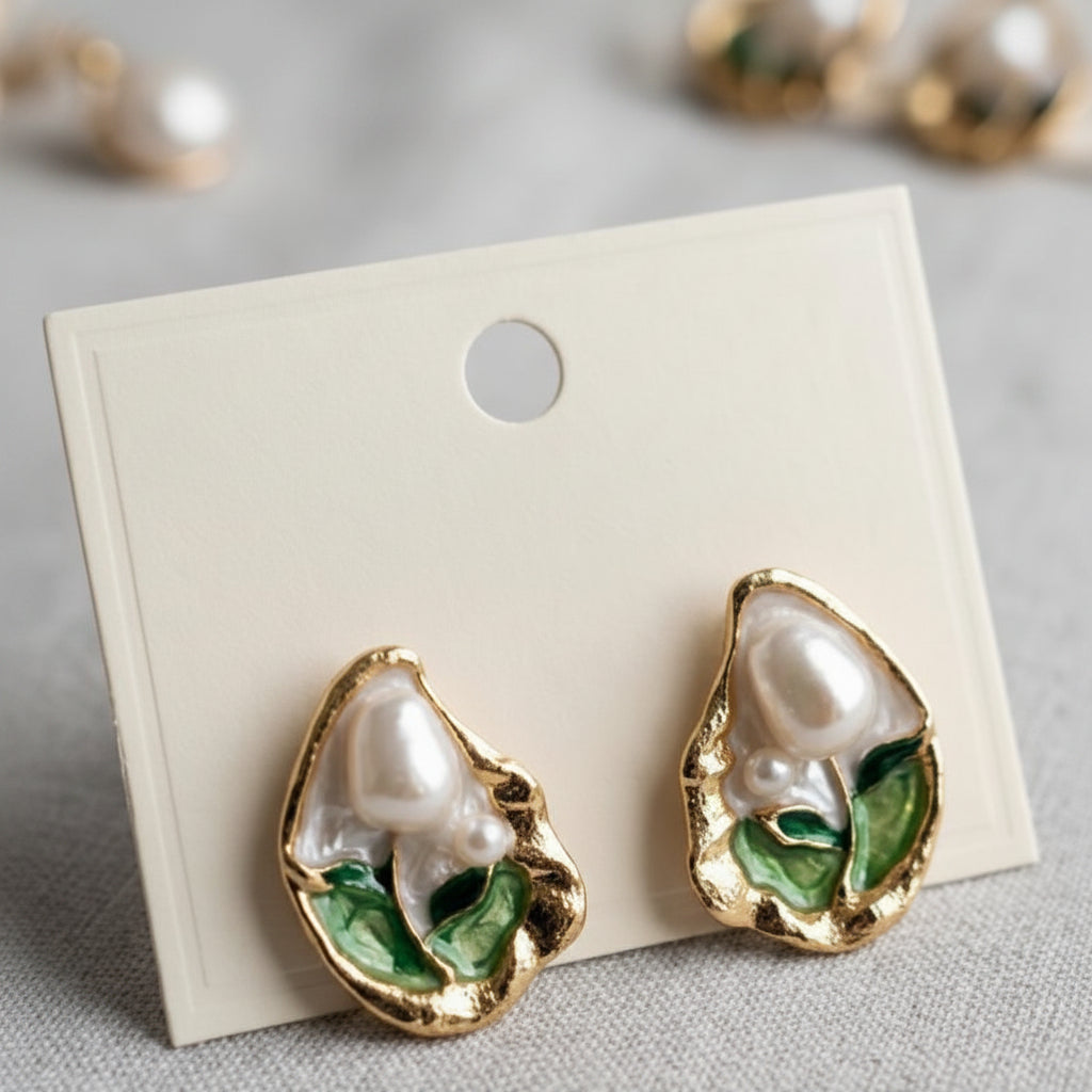 Pearl-themed earrings on a display card with a neutral background