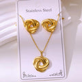 Gold knot necklace and earrings on a white card with 'Stainless Steel' text.