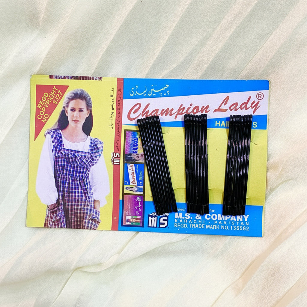Packaged hair extensions with 'Champion Lady' branding on a light fabric background