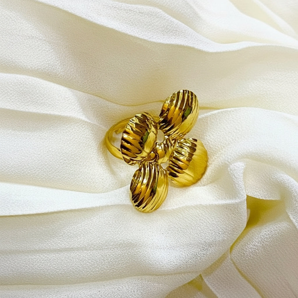 Gold ring on a white fabric background