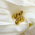 Gold ring on a white fabric background