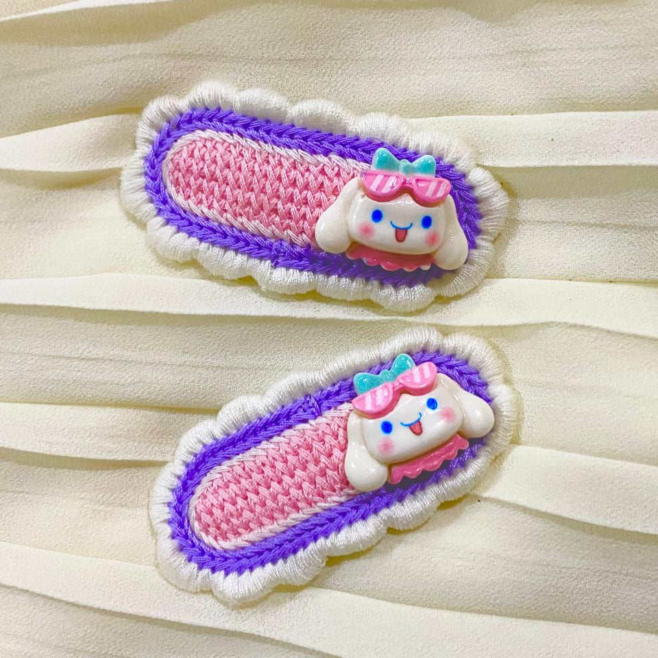 Two colorful sandal-shaped patches on a sheer white fabric background