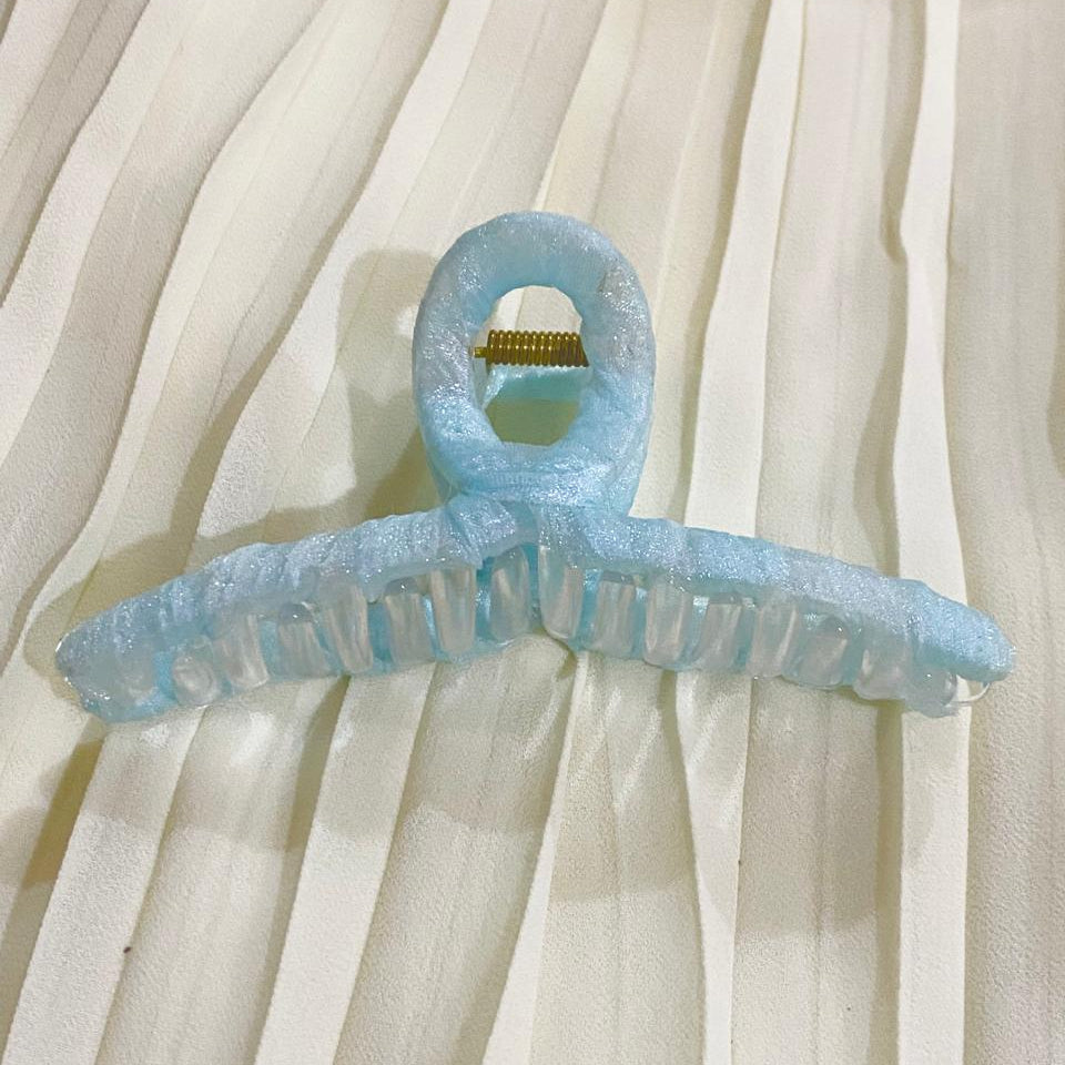 Light blue hanger on a white curtain background
