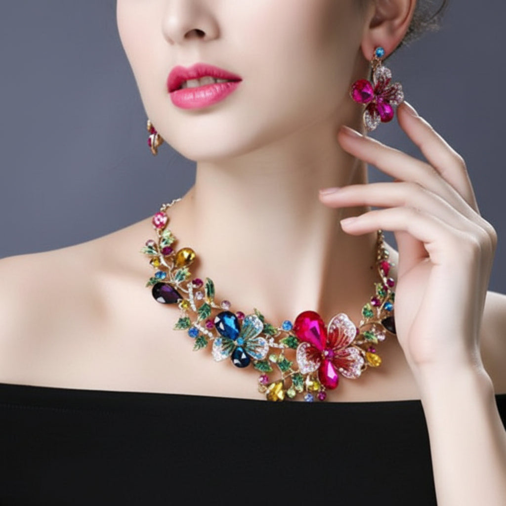 Colorful jewelry set including necklace and earrings on a model against a gray background