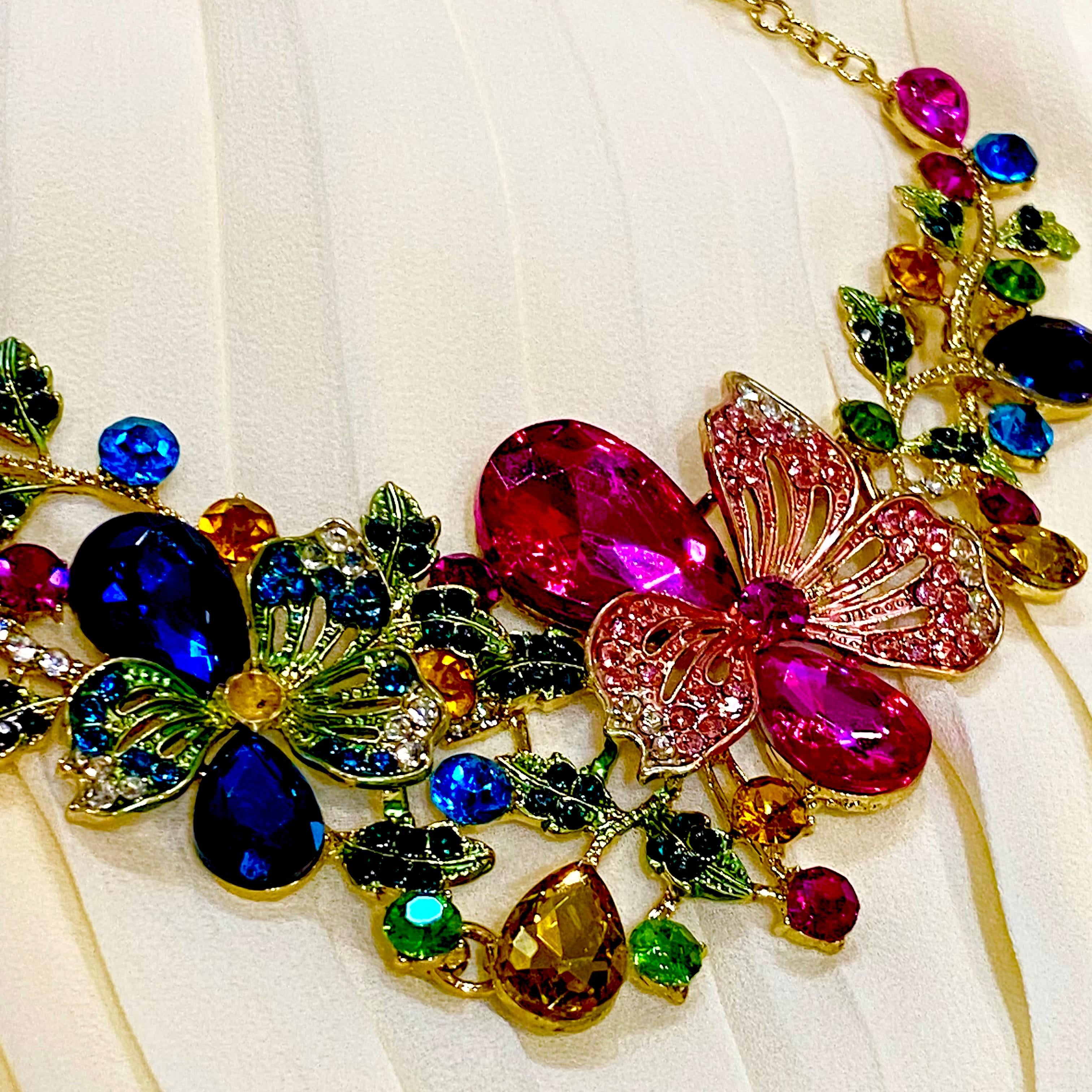 Colorful butterfly-shaped jewelry on a white fabric background