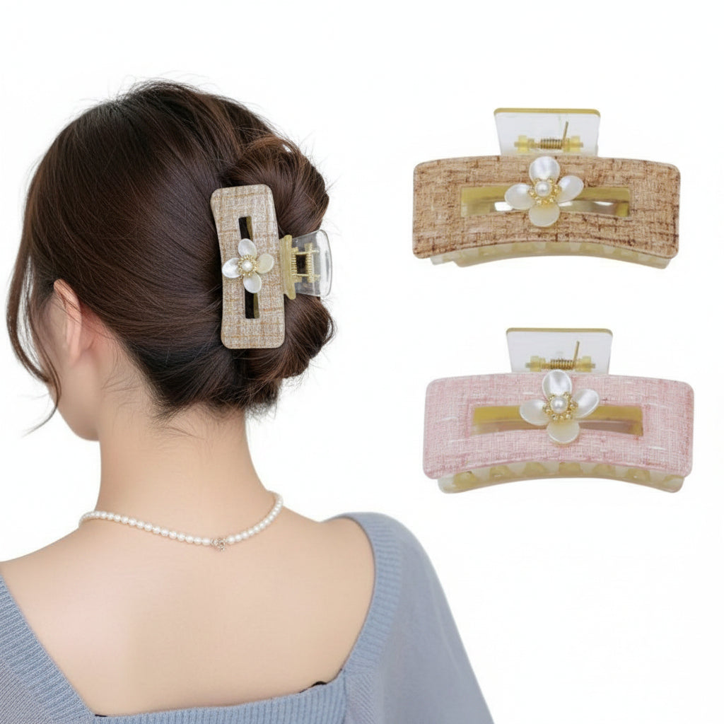 Woman styling her hair with a decorative hair clip, surrounded by three additional hair clips on a white background.